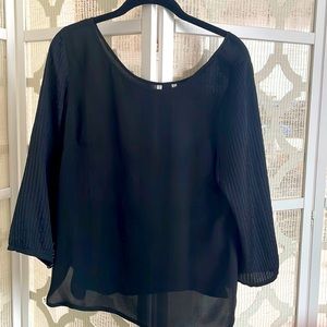 Beautiful silk top with scoop-neck back and delicate pleating on arms.